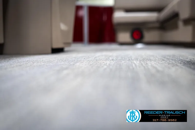 Slide: The Image of Interior view of 2025 Bennington 21 SLS pontoon boat, featuring carpet flooring. - 42