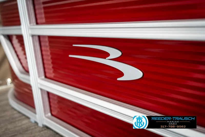 Slide: The Image of 2025 Bennington 21 SLS pontoon boat with red exterior and logo detail. - 43