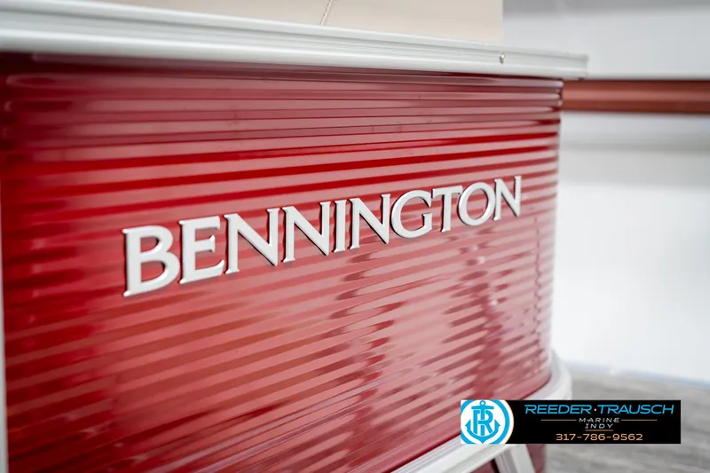 Slide: The Image of Red Bennington 21 SLS boat, 2025 model, with dealership logo and contact information. - 45