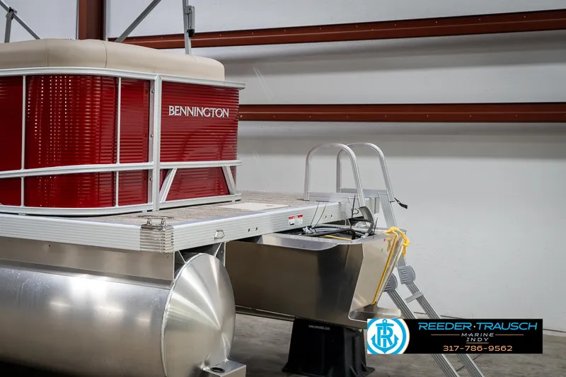 Slide: The Image of 2025 Bennington 21 SLS pontoon boat in a showroom setting. - 46