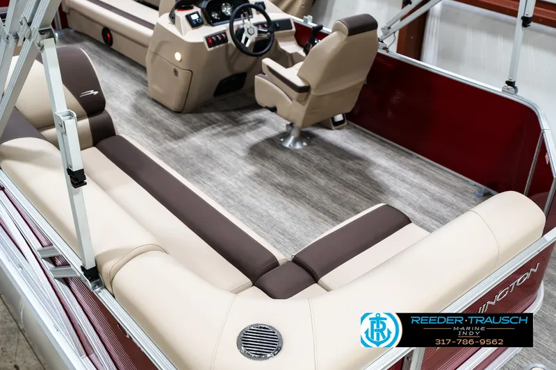 Slide: The Image of 2025 Bennington 21 SLS boat interior with beige seating and wood-style flooring. - 8