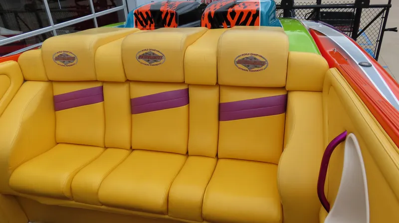 Slide: The Image of Yellow and purple seating on 2001 Outerlimits 42 Legacy boat. - 13