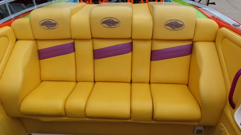 Slide: The Image of Yellow and purple seating in a 2001 Outerlimits 42 Legacy boat. - 14