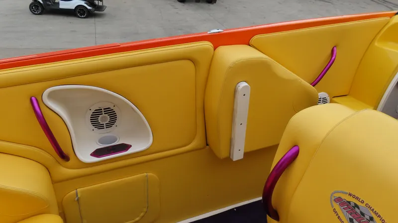 Slide: The Image of 2001 Outerlimits 42 Legacy boat interior with vibrant yellow and orange seating. - 18