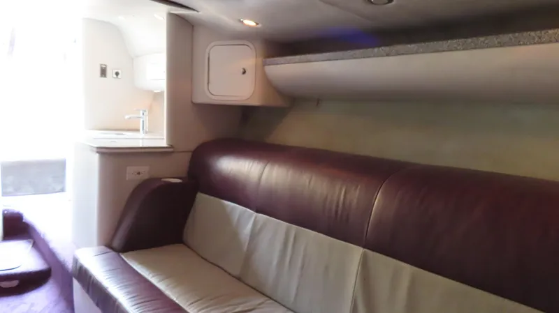 Slide: The Image of Interior of 2001 Outerlimits 42 Legacy boat with leather seating and kitchenette. - 24