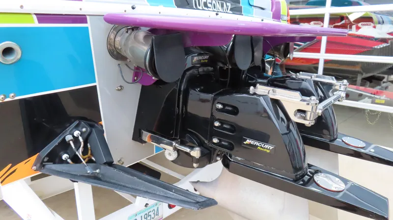 Slide: The Image of 2001 Outerlimits 42 Legacy boat with Mercury engines and colorful hull design. - 7