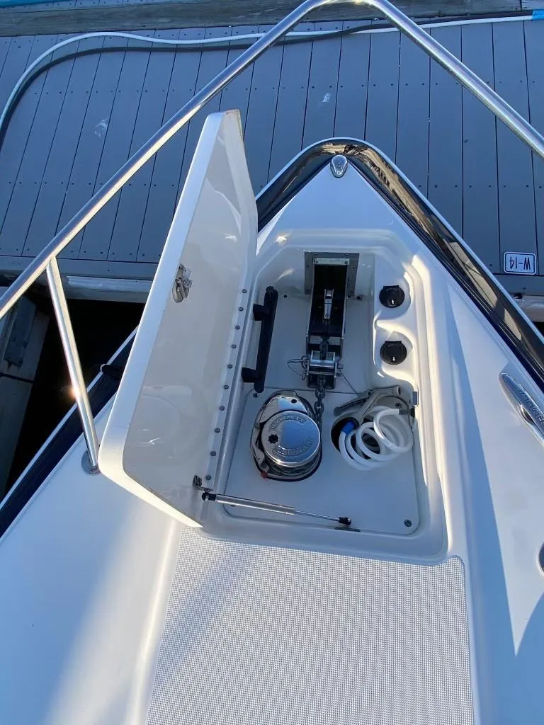 Slide: The Image of 2016 Formula 350 Sun Sport boat anchor compartment with open hatch. - 18