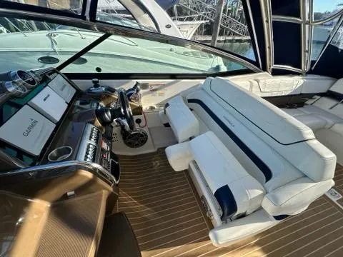Slide: The Image of Interior of 2016 Formula 350 Sun Sport boat with luxurious seating and modern dashboard. - 19
