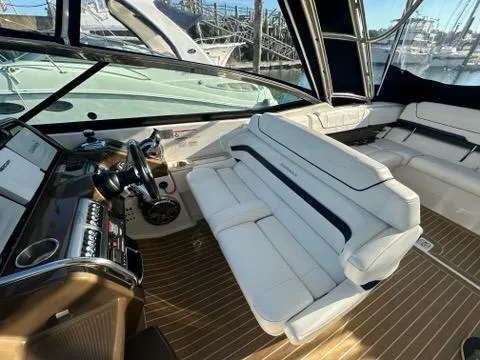 Slide: The Image of Interior of 2016 Formula 350 Sun Sport boat with white seating and wooden flooring. - 20