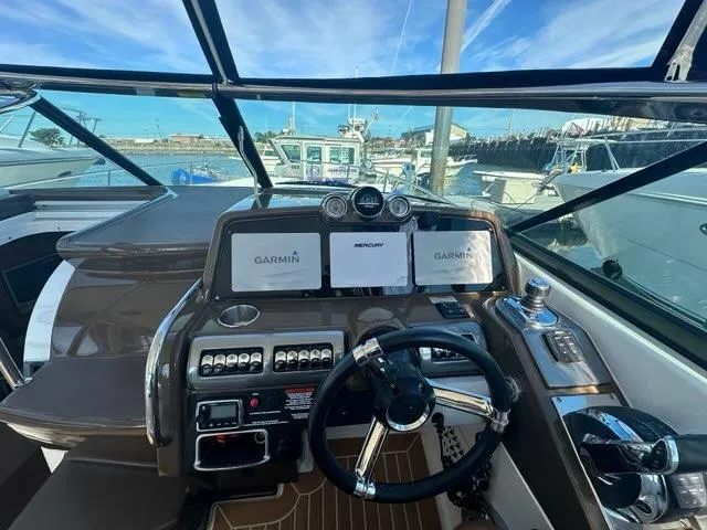 Slide: The Image of 2016 Formula 350 Sun Sport dashboard with Garmin navigation, docked at marina. - 21