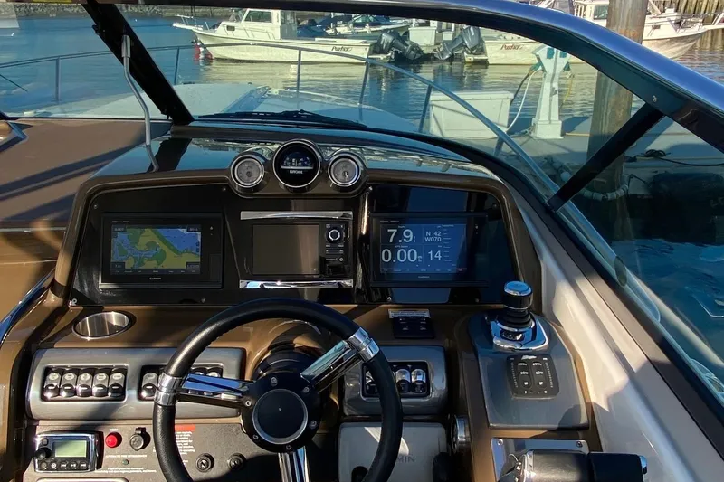 Slide: The Image of 2016 Formula 350 Sun Sport dashboard with navigation and control systems. - 22