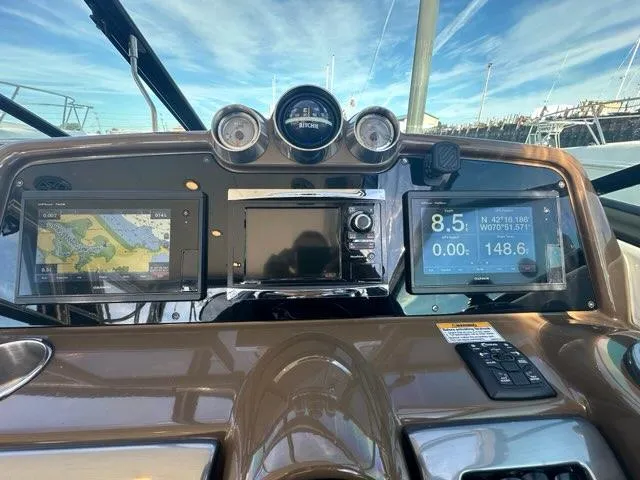 Slide: The Image of 2016 Formula 350 Sun Sport dashboard with navigation and control displays. - 23