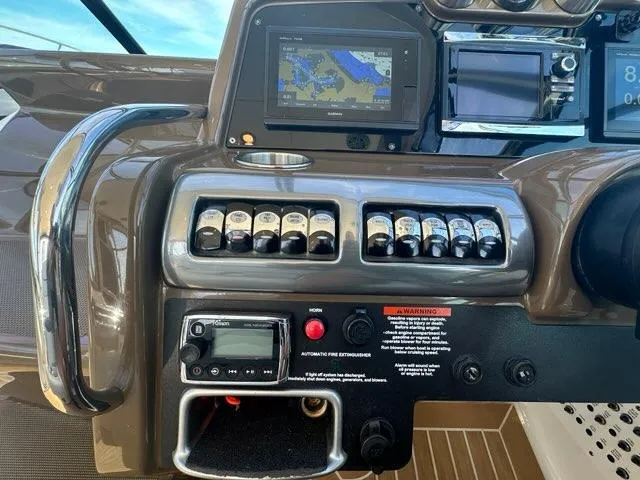 Slide: The Image of Control panel of 2016 Formula 350 Sun Sport boat with navigation screens and switches. - 24