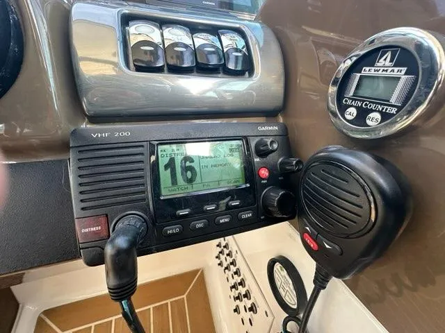 Slide: The Image of VHF radio and chain counter on 2016 Formula 350 Sun Sport boat dashboard. - 25