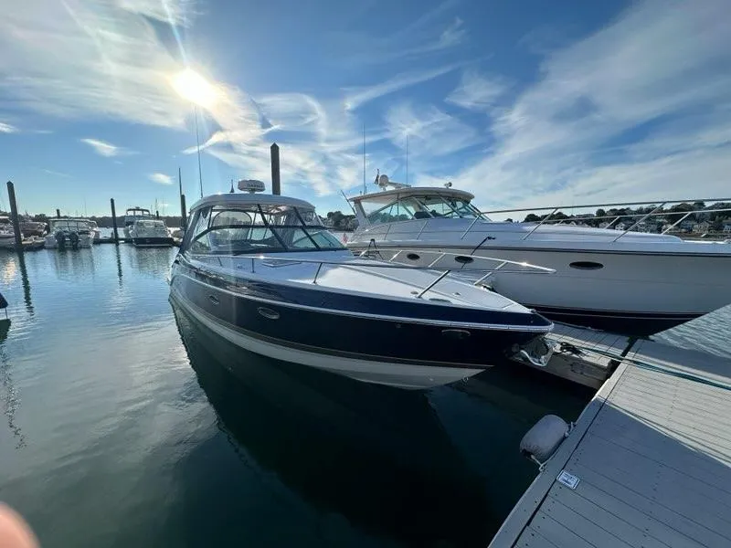 Slide: The Image of 2016 Formula 350 Sun Sport yacht docked at marina under blue sky. - 3