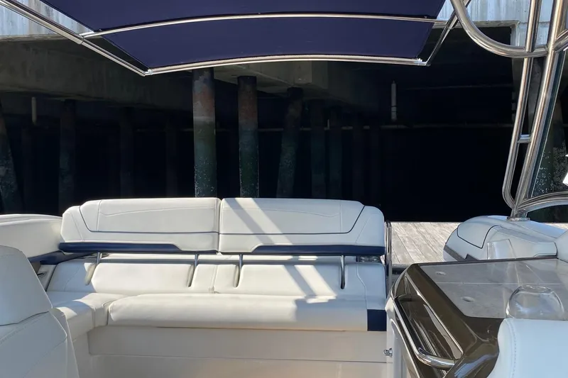 Slide: The Image of 2016 Formula 350 Sun Sport boat interior with white seating and canopy. - 33