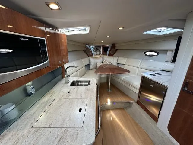 Slide: The Image of Luxurious interior of 2016 Formula 350 Sun Sport yacht with modern kitchen and seating area. - 37