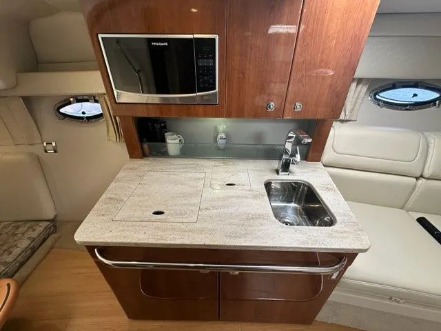 Slide: The Image of 2016 Formula 350 Sun Sport yacht interior kitchen with sink and microwave. - 48
