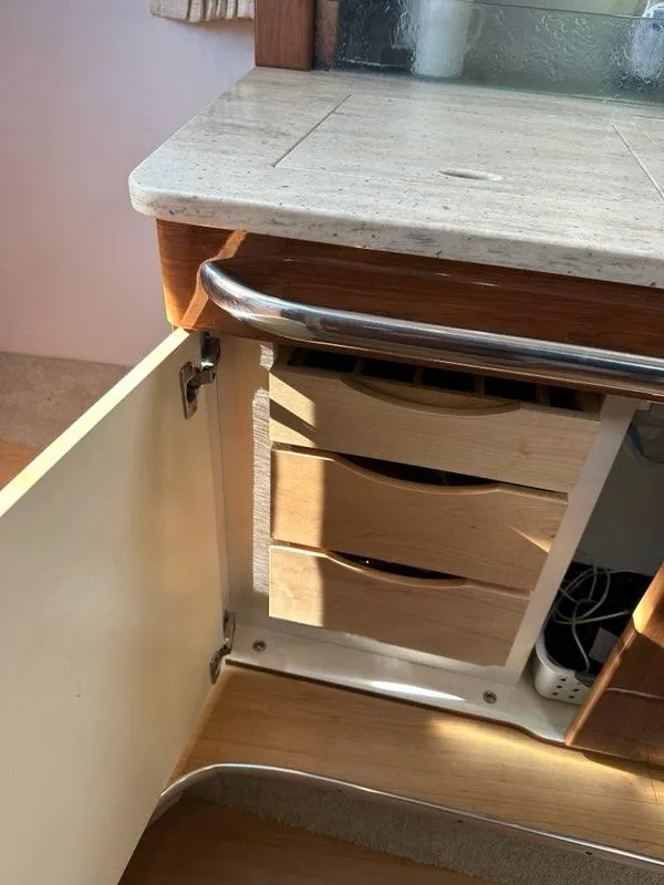 Slide: The Image of 2016 Formula 350 Sun Sport interior with open cabinet and wooden drawers. - 49