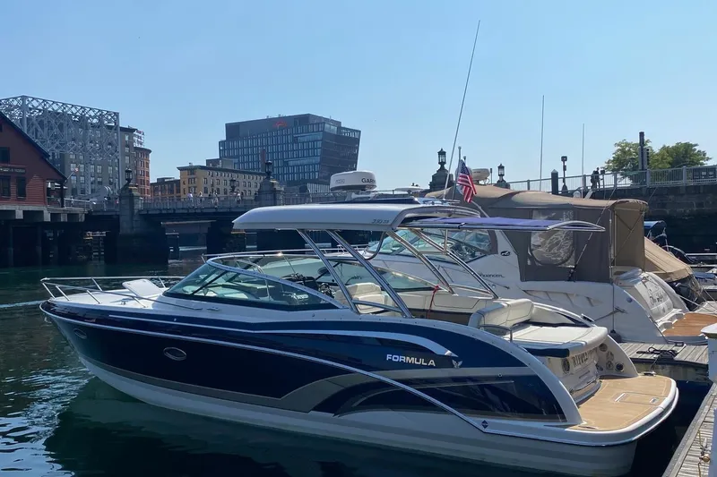 Slide: The Image of 2016 Formula 350 Sun Sport boat docked in urban marina setting. - 5