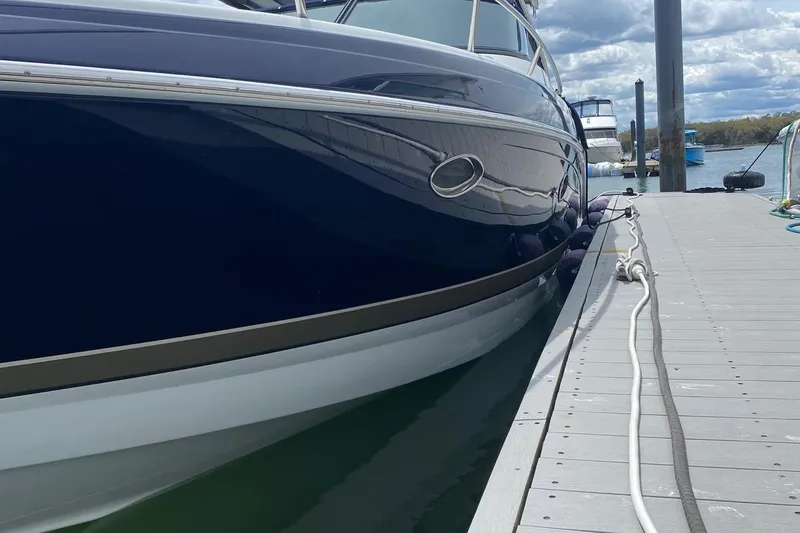 Slide: The Image of 2016 Formula 350 Sun Sport docked at marina, sleek design, calm waters. - 6