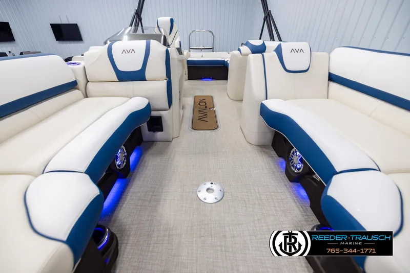 Slide: The Image of Luxurious interior of 2025 Avalon Catalina VRB pontoon boat with blue and white seating. - 13