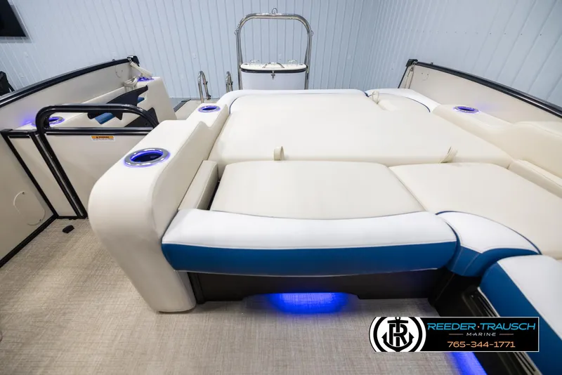 Slide: The Image of 2025 Avalon Catalina VRB boat interior with luxurious seating and blue LED lighting. - 15