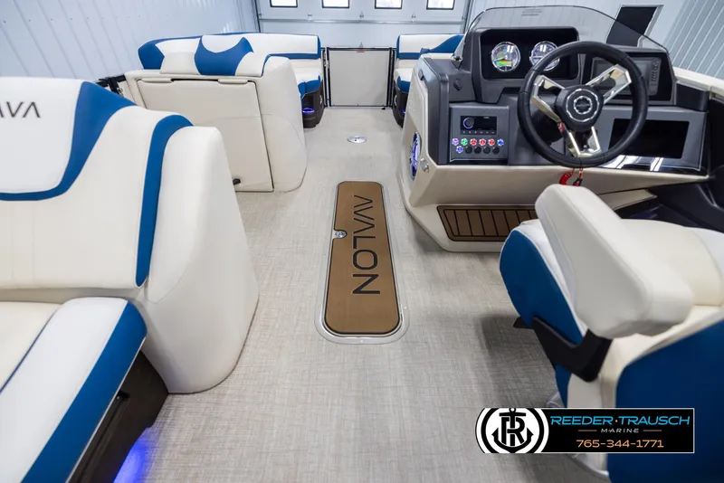 Slide: The Image of Interior of 2025 Avalon Catalina VRB boat with modern seating and steering console. - 17