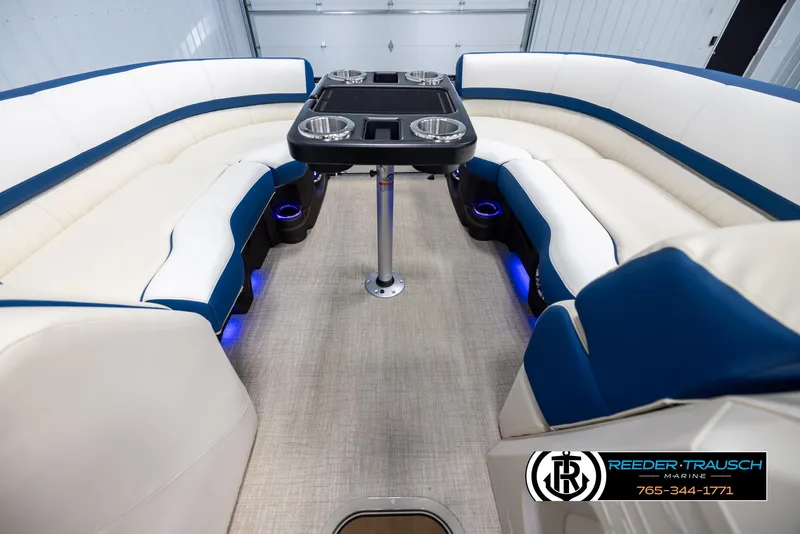 Slide: The Image of Luxurious interior of 2025 Avalon Catalina VRB pontoon boat with plush seating and table. - 20