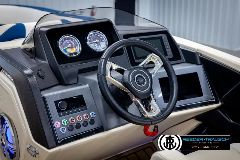 Slide: The Image of 2025 Avalon Catalina VRB boat dashboard with steering wheel and control panel. - 28