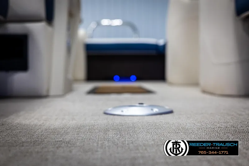 Slide: The Image of 2025 Avalon Catalina VRB interior with carpeted flooring and seating, Reeder-Trausch Marine logo visible. - 40