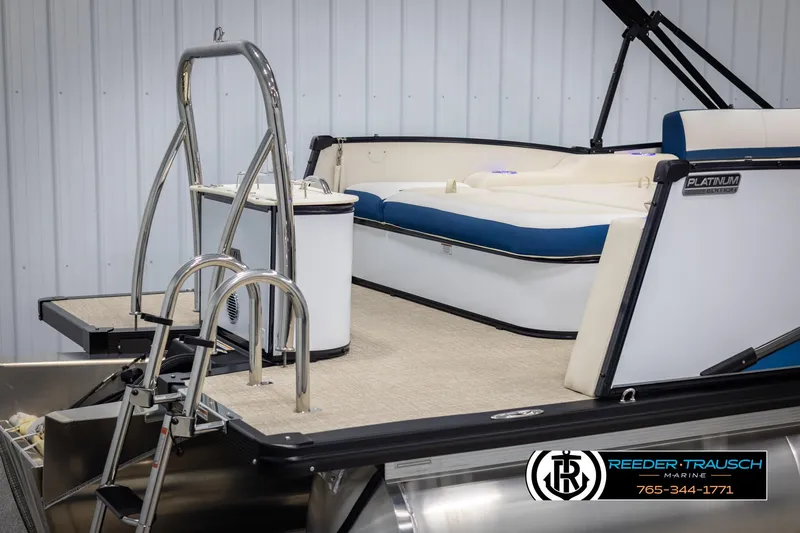 Slide: The Image of 2025 Avalon Catalina VRB pontoon boat with ladder and seating, Reeder-Trausch Marine branding. - 41