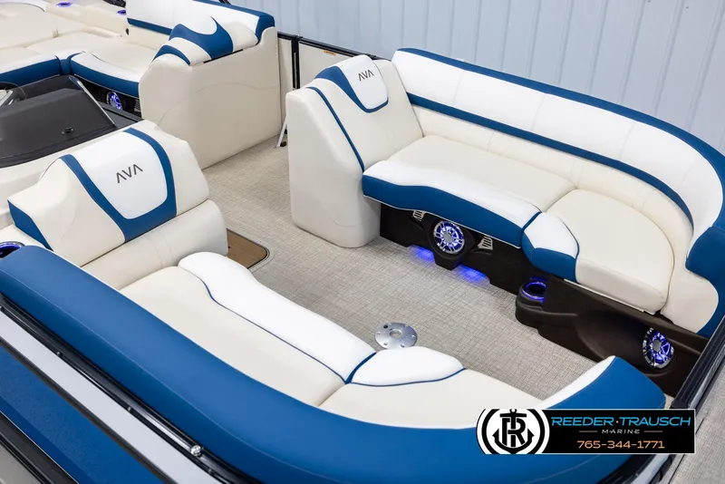 Slide: The Image of Luxurious 2025 Avalon Catalina VRB boat interior with blue and white seating, ambient lighting. - 9