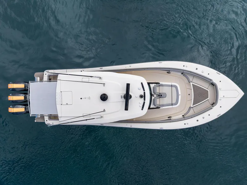 Slide: The Image of Overhead view of 2023 Scout 425 LXF boat on water. - 21