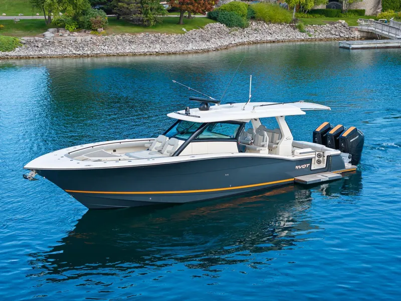 Slide: The Image of 2023 Scout 425 LXF boat on calm water, featuring sleek design and powerful engines. - 27