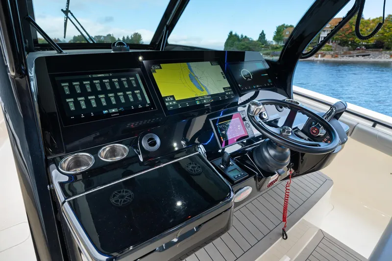 Slide: The Image of 2023 Scout 425 LXF boat dashboard with advanced navigation and control systems. - 30