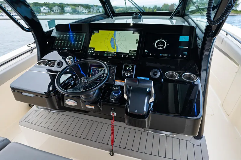 Slide: The Image of 2023 Scout 425 LXF boat dashboard with advanced navigation and control systems. - 31