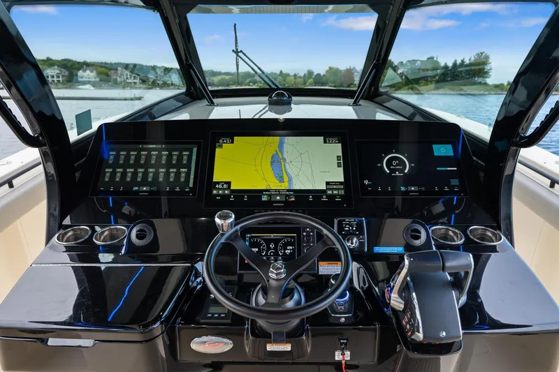 Slide: The Image of 2023 Scout 425 LXF boat dashboard with advanced navigation and control systems. - 32
