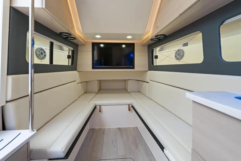 Slide: The Image of Luxurious interior of 2023 Scout 425 LXF boat with modern seating and entertainment system. - 35