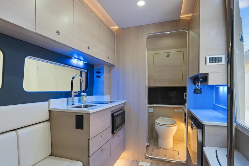Slide: The Image of Luxurious 2023 Scout 425 LXF interior with modern kitchen and bathroom amenities. - 36