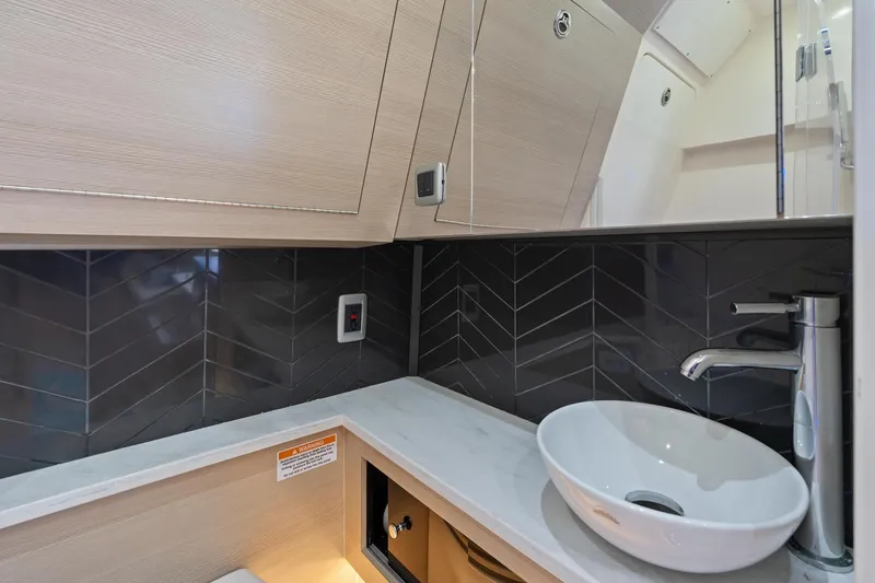 Slide: The Image of Luxurious bathroom in 2023 Scout 425 LXF boat with modern sink and sleek design. - 42