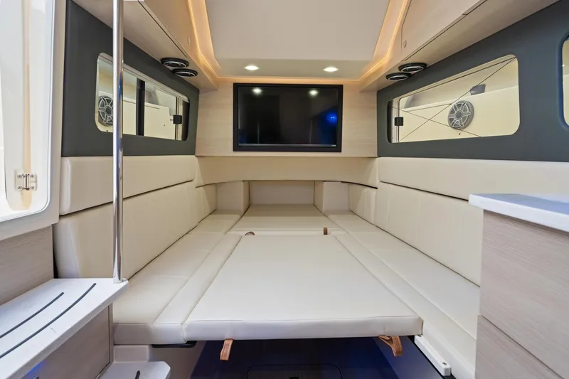 Slide: The Image of Luxurious interior of 2023 Scout 425 LXF boat with modern seating and entertainment system. - 43