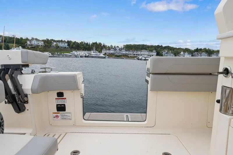 Slide: The Image of 2023 Scout 425 LXF boat interior with waterfront view. - 45