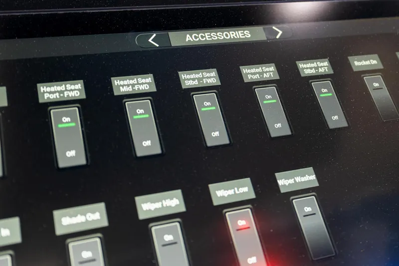 Slide: The Image of Control panel of 2023 Scout 425 LXF boat, showing heated seat and wiper settings. - 49