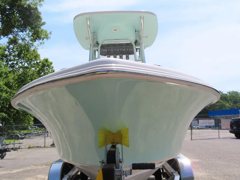 Slide: The Image of 2025 Key West 219 FS boat on trailer, front view, outdoors. - 12