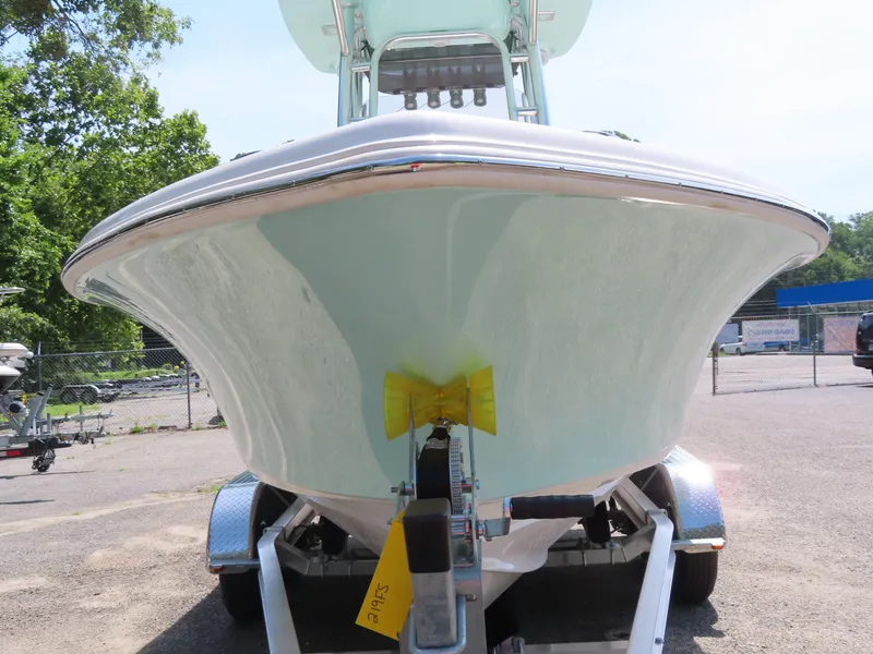 Slide: The Image of 2025 Key West 219 FS boat on trailer, front view in outdoor setting. - 13