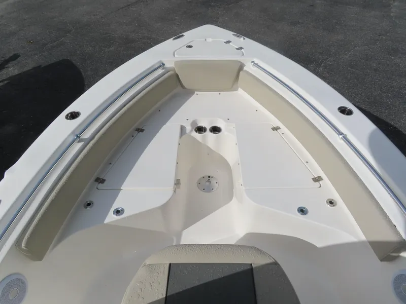 Slide: The Image of 2025 Key West 219 FS boat interior, featuring spacious seating and storage compartments. - 14