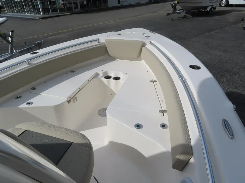 Slide: The Image of 2025 Key West 219 FS boat interior with seating and storage compartments. - 16
