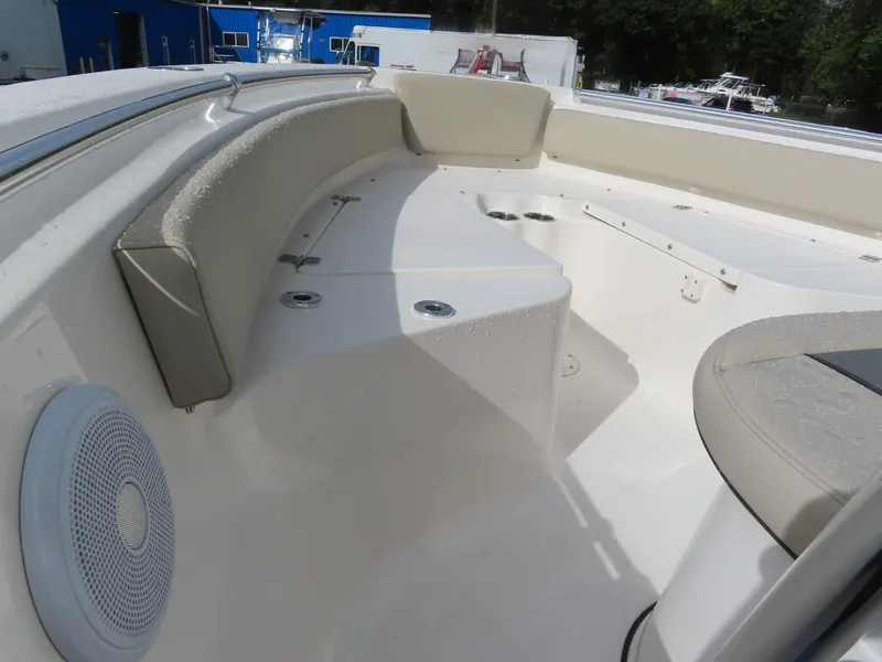 Slide: The Image of 2025 Key West 219 FS boat interior with seating and speaker. - 19