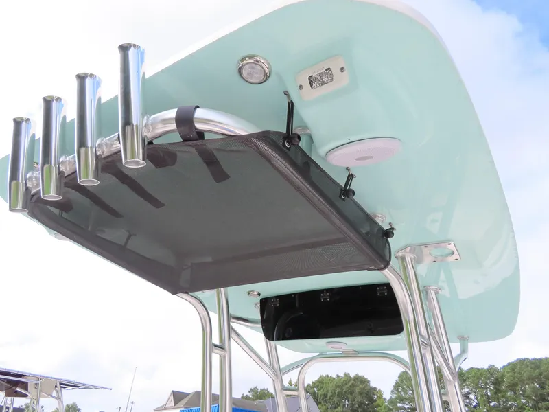 Slide: The Image of 2025 Key West 219 FS boat T-top with rod holders and storage. - 24